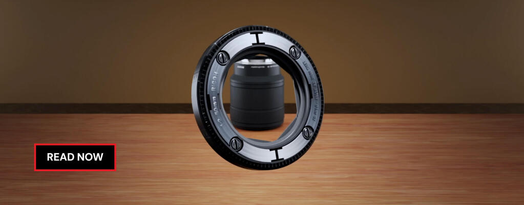A photorealistic 3D modeled camera lens is presented on a wooden table. 3D rendering, design studio, 3D product, animation, character design, 2D animation, video production services, book trailer services, digital marketing services, motion design, motion graphics. RDV Media – Multimedia production company. Serving brands globally. New York, Los Angeles, California, Atlanta, USA, Dublin, Ireland, EU, London, England, UK, Doha, Qatar, UAE, Abu Dhabi, Ajman, Dubai, Fujairah, Ras Al Khaimah, Sharjah, and Umm Al Quwain.