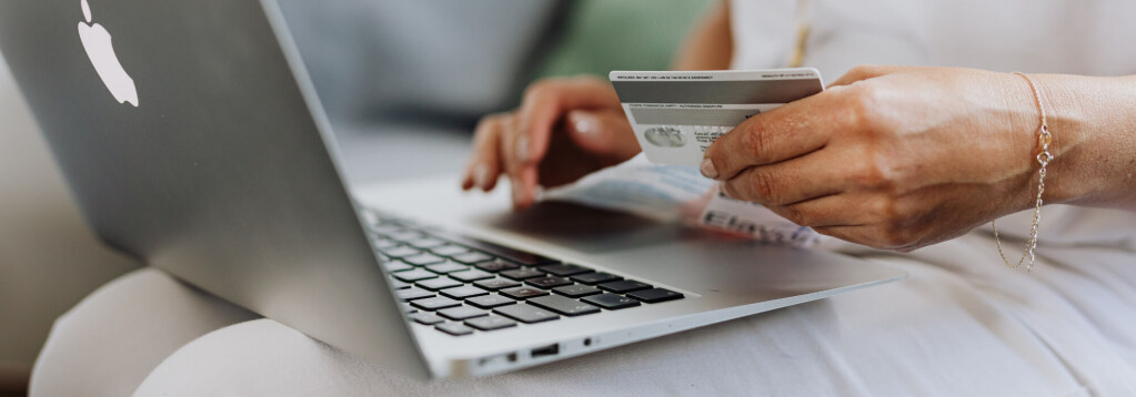 Person holding a credit card while typing on a laptop keyboard, suggesting an online shopping or payment process. 3D rendering, design studio, 3D product, animation, character design, 2D animation, video production services, book trailer services, digital marketing services, motion design, motion graphics. RDV Media – Multimedia production company. Serving brands globally. New York, Los Angeles, California, Atlanta, USA, Dublin, Ireland, EU, London, England, UK, Doha, Qatar, UAE, Abu Dhabi, Ajman, Dubai, Fujairah, Ras Al Khaimah, Sharjah, and Umm Al Quwain.